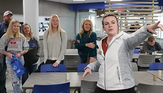 a campus tour guide shows off the dining hall